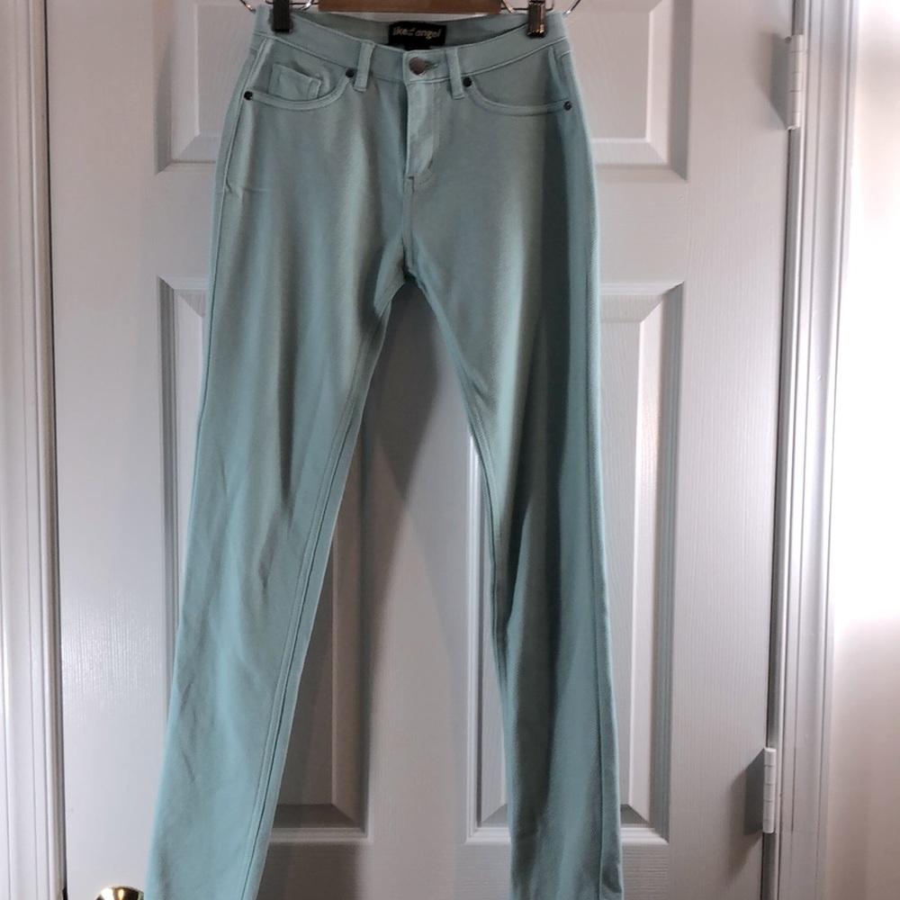 Like an Angel teal skinny leg jeggings.